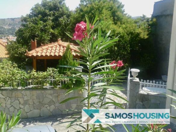Garden with pergola and flowering oleanders at a house in Mitilinioi, Samos