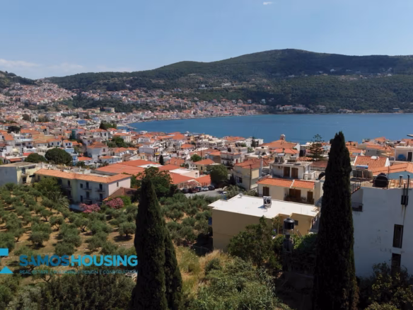 Panoramic view over the rooftops and bay of Samos Town, Samos