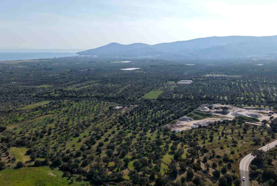 Aerial view of rural buildable plot near Chora Samos with sea view to Potokaki beach SH578