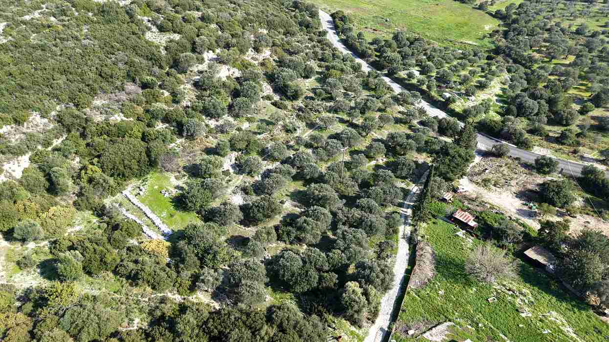 Drone overview of buildable hillside land near Chora Samos SH578 Samos Housing