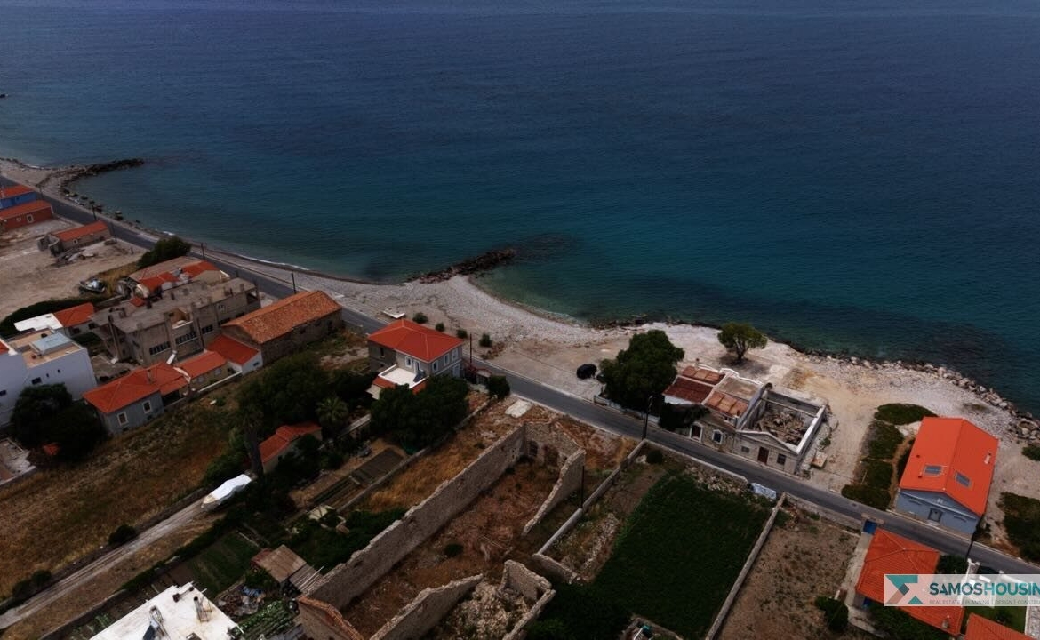 Aerial view of the Karlovasi coastline near the SH589 plot, showing the beach and coast road