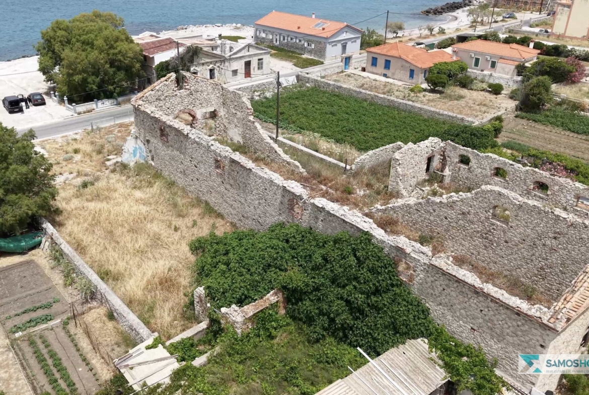 Aerial view of the stone ruin's interior walls on the SH589 plot, near the sea in Karlovasi