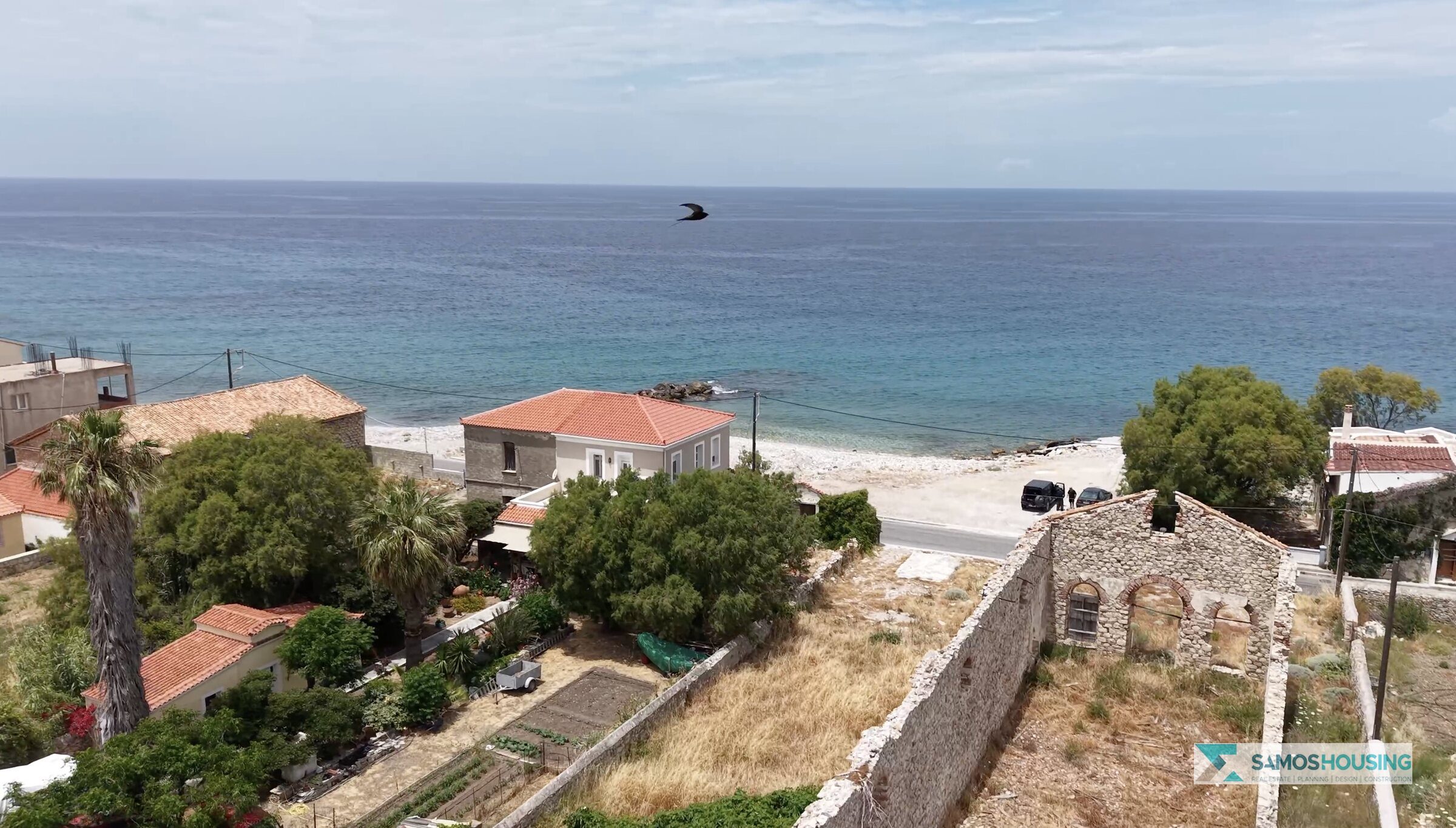 View from the SH589 plot toward the sea and beach in Karlovasi, Samos