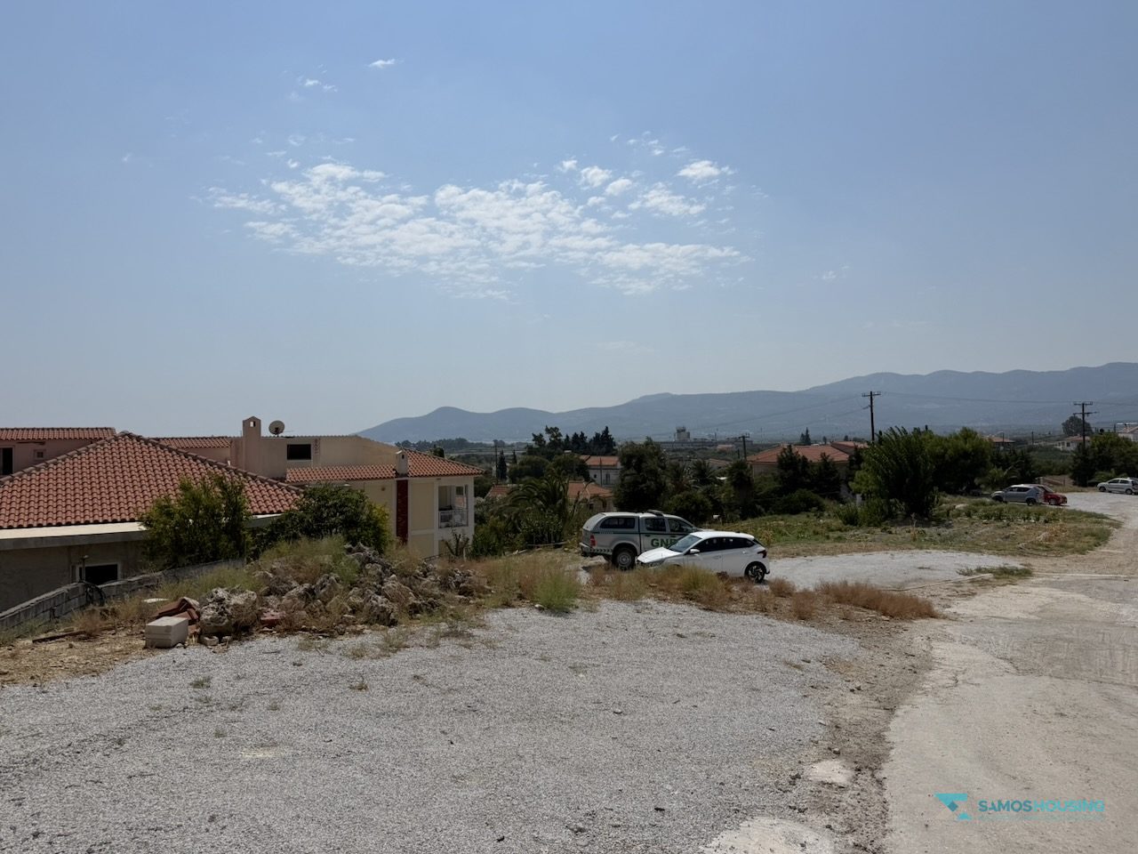 SH591 Land Pythagorio Samos 03 Open building ground with the mountain backdrop of Nea Poli, Samos