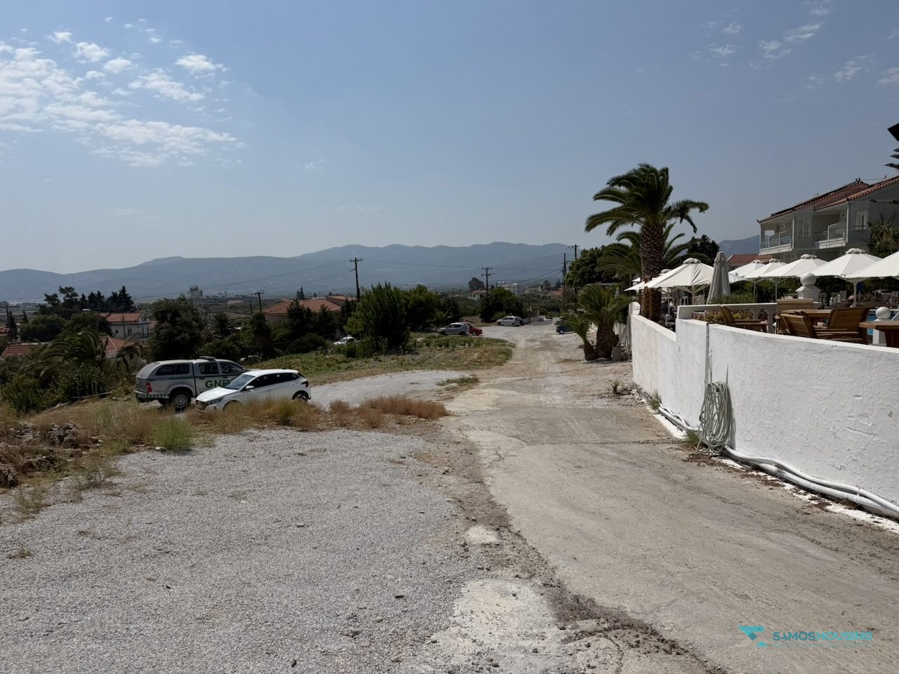 SH591 Land Pythagorio Samos 05 Northern boundary of the land beside the neighbouring hotel wall, Pythagorio Samos