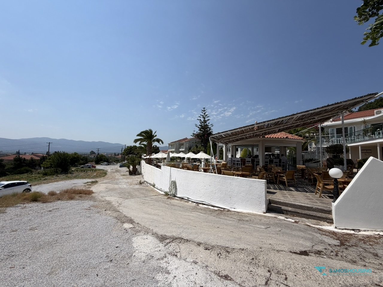 SH591 Land Pythagorio Samos 06 Neighbouring hotel terrace along the land boundary in Nea Poli, Samos