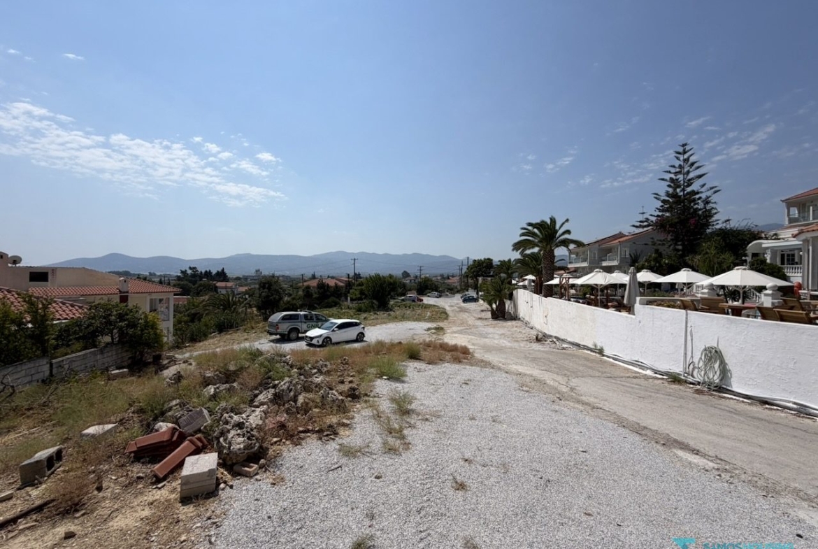 Wide view of the buildable ground with the hotel complex behind, Samos