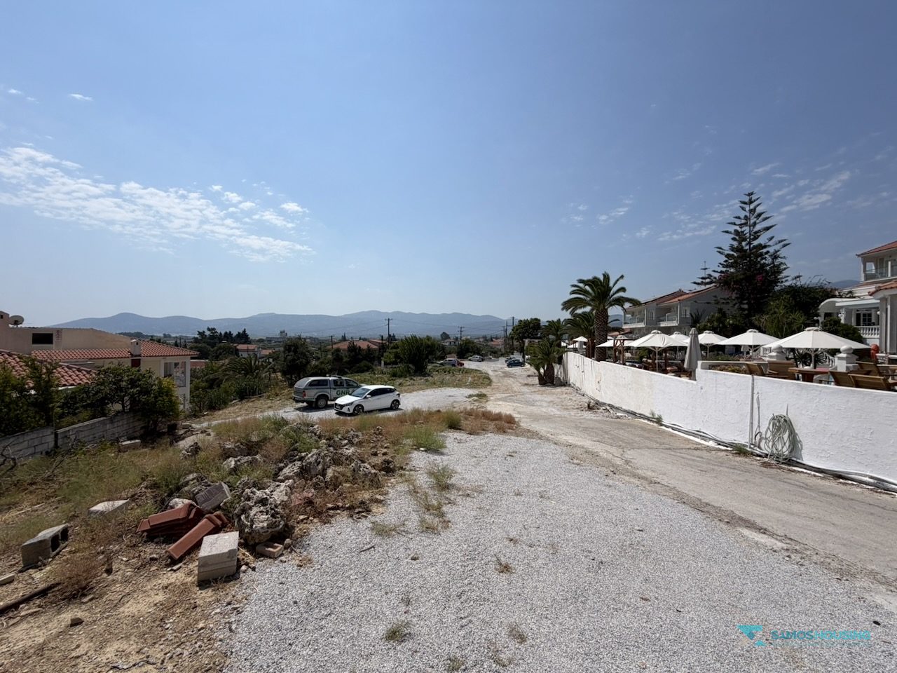 SH591 Land Pythagorio Samos 10 Wide view of the buildable ground with the hotel complex behind, Samos