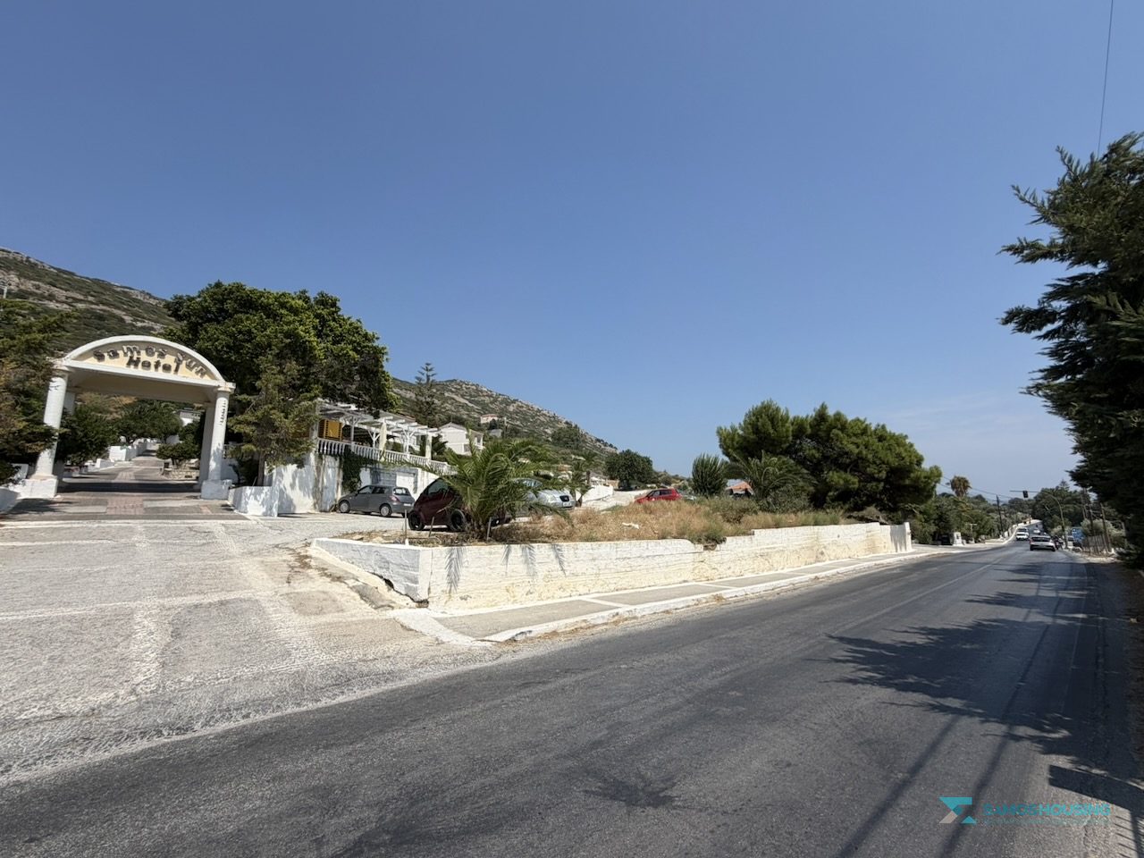 SH591 Land Pythagorio Samos 12 Stone retaining wall and pavement on the road frontage of the parcel, Samos