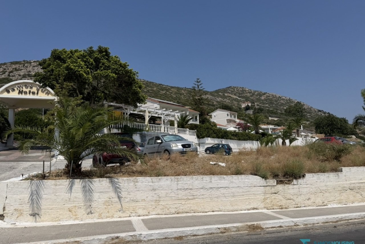 Roadside boundary wall with the hills of Samos behind