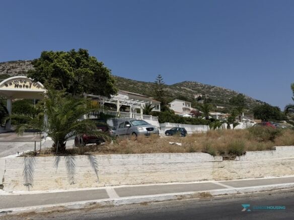 Roadside boundary wall with the hills of Samos behind