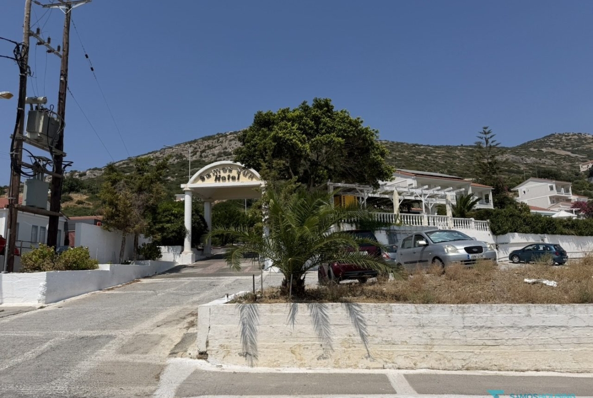 Neighbouring buildings along the road opposite the parcel, Nea Poli Samos