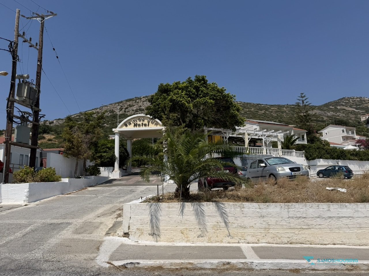 SH591 Land Pythagorio Samos 16 Neighbouring buildings along the road opposite the parcel, Nea Poli Samos