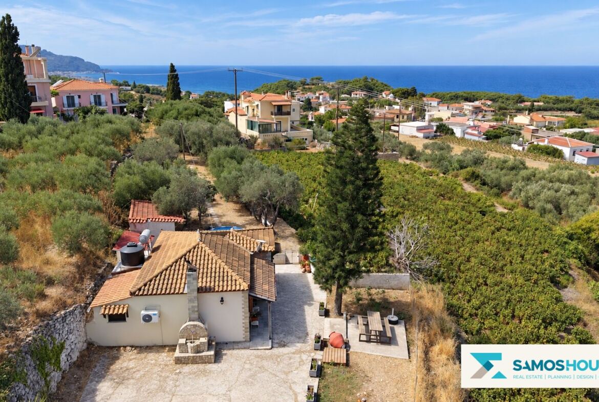 Aerial view of the house and garden in Kontakaiika, Samos, with the sea beyond