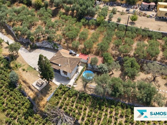 Aerial overview of the property and surrounding plots
