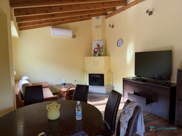 Living room with fireplace, air conditioning and timber ceiling, Samos cottage
