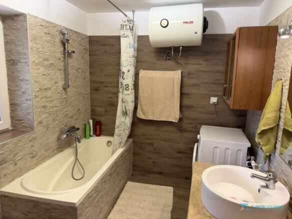 Bathroom with bathtub, washing machine and water heater, Samos cottage