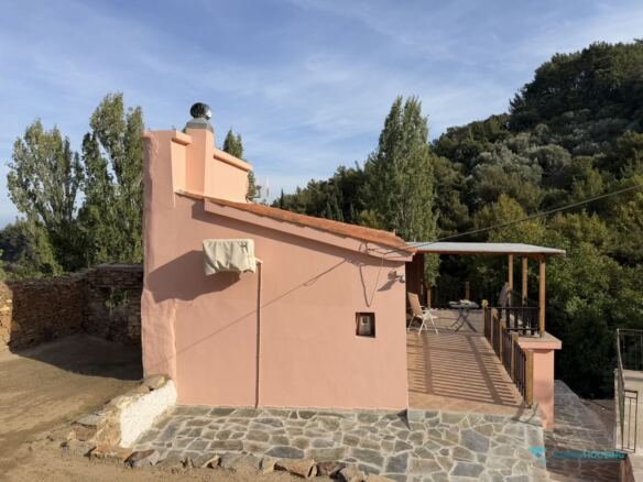 Rear facade of the cottage and stone walls, Stavrinides, Samos
