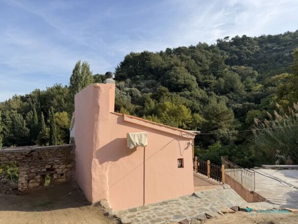 House against the wooded hillside of north Samos, Stavrinides