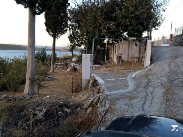 Concrete village road giving access to the plot